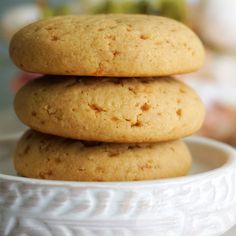 three cookies stacked on top of each other in a white bowl