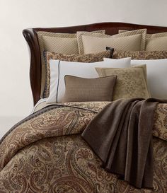 the comforter is neatly made and ready for guests to use in their bed room