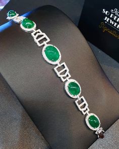 "A DREAM COMES TRUE! Gorgeous masterpiece! ONE OF A KIND Bracelet! Featuring 7 pieces of extra fine GLOWING VIVID GREEN Zambian Emerald weighting a total of 58.94 carats... and 334 pieces of SUPER SPARKLING, top-grade, F/VS Diamonds (4.01 carat in total). SET IN ONE-OF-A-KIND 18K Solid White Gold, meticulously designed and handcrafted BRACELET! A true heirloom piece that can transcend beyond times and eras.... JUST FINISHED, HANDMADE BY OUR GOLDSMITHS! DAZZLING GENUINE EMERALDS! Extremely rare, White Gold Emerald Bracelets, Round White Gold Bracelets With Emeralds, White Gold Emerald Bracelet, Luxury Round Emerald Bracelets, Luxury Silver Bracelets With Cabochon, Wooden Bracelet, Zambian Emerald, Unusual Jewelry, Handcrafted Bracelets