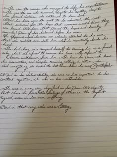 a handwritten letter is on top of a piece of lined paper with writing in cursive ink