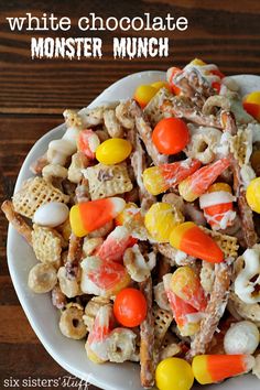 white chocolate monster munch cereal mix on a plate with candy corn and candies