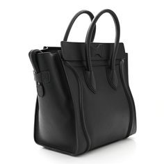 This is an authentic CELINE Drummed Calfskin Mini Luggage in Black. This sophisticated tote is crafted of calfskin leather in black. This handbag features rolled leather top handles, an exterior zipper pocket, expandable sides, and the top zipper opens to a black suede interior with zipper and patch pockets. Luggage Black, Mini Luggage, Celine Luggage Bag, Bag Light, Natural Tan, White Bag, Leather Top, Tri Color, Belt Bag