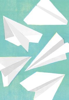 three white paper airplanes are flying in the blue sky, and one is upside down