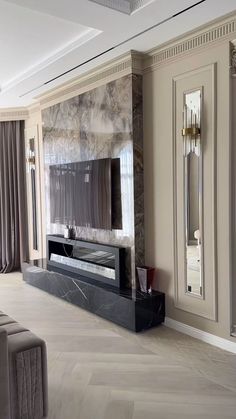 an elegant living room with marble walls and flooring