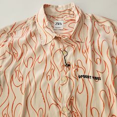 Nwot Zara Allover Print Button-Down Shirt In Oyster White & Orange Print With " Upbeat Vibes" Printed On Left Chest ||| Relaxed Fit With A Silky Feel ||| Lapel Collar ||| Longsleeve With Buttoned Cuffs ||| 100% Polyester ||| Orange Collared Shirt With Graphic Print, Orange Graphic Print Collared Tops, Zara Orange Short Sleeve Tops, Zara Orange Casual Top, Casual Orange Zara Top, Orange Collared Camp Shirt For Summer, Orange Collared Summer Blouse, Trendy Orange Summer Shirt, Casual Orange Collared Shirt