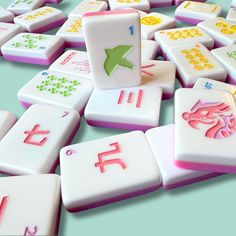 a pile of white and pink dices sitting on top of each other next to each other