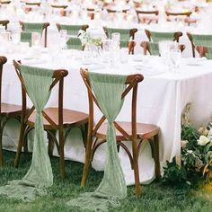 the tables are set with white and green linens