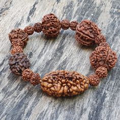 📿This unique bracelet is made from genuine sacred seeds of 2- 7 Mukhi Rudraksha. Wear this wrist seed bracelet to reap its amazing benefits.📿 2 Mukhi Rudraksha - It is also beneficial for those who are in search of the best life partner. It also helps to bring pleasure and spiritual gains to the wearer life. 3 Mukhi Rudraksha - Three Mukhi rudraksha has a soothing effect on one's mind and body. Three Mukhi Rudraksha is the form of three types of Agni (fire) and also the symbol of Three Deva i. Hand Bracelet For Men, Best Life Partner, Rudraksha Bracelet, Peridot Bracelet, Beads Mala, Sea Glass Bracelet, Tiger Eye Jewelry, Zodiac Bracelet, Black Beaded Bracelets