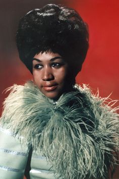 an old photo of a woman wearing a fur coat