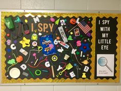 a bulletin board with lots of different items on it and a sign that says i spy with my little eye