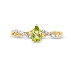 Capture your elegant and feminine style when you wear this pear-shaped green peridot and diamond loose braid ring in 10K gold. Crafted in warm 10K gold This look shines with a 6.0 x 4.0mm pear-shaped spring-green peridot center stone. Polished and diamond-lined ribbons create a loose twist design along the split shank. This ring sparkles with 1/20 ct. t.w. of diamonds. Loose Braid, Loose Braids, Braided Ring, Sparkling Rings, Green Peridot, Split Shank, Spring Green, 10k Gold, Feminine Style