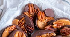 chocolate covered pecans with nuts in the middle