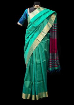 Discover the timeless elegance of our Sea Green and Beetroot Red Pure Raw Silk Saree. With a captivating Zari Border and Striped Pallu, this saree exudes sophistication and grace. Immerse yourself in the finest raw silk fabric, intricately crafted to enhance its allure, and find the perfect choice for any special occasion. The mesmerizing blend of Sea Green and rich Pink hues create a sense of tranquility and opulence, while the striped pallu adds a captivating visual appeal. Elevate your style and comfort with the luxurious drape of this saree, perfect for those seeking elegance and tradition. Whether you're attending a wedding, festival, or celebratory event, this saree is sure to make a statement with its timeless beauty and impeccable craftsmanship. Pair it with gold jewelry and minima Luxury Silk Mark Certified Tissue Silk Saree, Luxury Raw Silk Pre-draped Saree With Zari Weaving, Raw Silk Saree, Raw Silk Fabric, Minimal Makeup, Bold Accessories, Green And Pink, Blouse Fabric, Sea Green