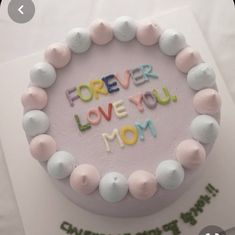 a birthday cake with the words forever love you mom written on it in frosting