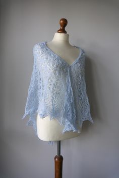 Handmade beautiful light blue shawl; blue shawl; lace shawl; gentle lace shawl; wedding accessories; wedding shawl ; merino wool lace shawl  The shawl is 100% hand-knitted.  Beautiful  lace shawl in light blue/ blue color.  It 's very elegant and feminine. So soft and gentle.  Made of high quality yarn - 100% merino wool.  Perfect for any time of year and any occasion.  Style: boho, hippie, elegant Measures: 164cm x 80cm  Please read - notice To keep the shawl beautiful, soft and in perfect condition, you should only hand wash it in lukewarm water with a delicate soap. Don't use too much detergent. Don't use fabric softener. Don't iron. Lace Shawl Scarf For Weddings, Lace Wedding Scarf Shawl, Lace Shawl Scarves For Wedding, Lace Shawl For Weddings, Lace Wedding Shawl Scarf, Elegant Handmade Blue Scarves, Handmade Shawl Scarf For Wedding, Handmade Shawl Scarves For Wedding, Blue Shawl Wrap