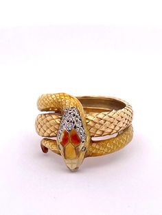 This Masriera Enamel Snake ring is very special.  Masriera is known for there Enamel and Plique a Jour pieces.  This is designed in the Art Nouveau revival style.  This ring features a textured body that resemble snake scales and is done in a highly polished enamel.  There is a bit of enamel loss not really noticeable on the head but otherwise it is special. The enamel is done in pale tones of yellow and orange with 13 bead set single cut Diamonds weighing .070 carats.  The ring also has a bit o Art Nouveau Revival, Plique A Jour, Snake Scales, Serpent Jewelry, Lapis Lazuli Jewelry, David Webb, Snake Jewelry, Snake Bracelet, Bead Set