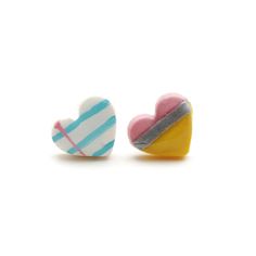 two heart shaped candies sitting next to each other