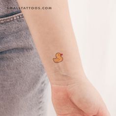 a small rubber ducky tattoo on the wrist