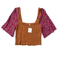 This Listing Is For A Free People Top. Please See Details Below: It Is New, With The Tag. The Label Has A Small Red Dot On It. Color Is Golden Combo 60% Cotton And 40% Modal Smocked Pink Bohemian Smocked Top For Summer, Bohemian Pink Top With Smocked Back, Fall Smock Top With Short Sleeves, Fall Smocked Short Sleeve Top, Smock Top With Short Sleeves For Fall, Multicolor Casual Smocked Short Sleeve Top, Casual Multicolor Top With Smocked Bodice, Pink Top With Smocked Back For Spring, Trendy Short Sleeve Top With Smocked Back