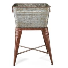 an old fashioned metal tub with legs