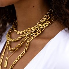 Elevate your everyday look with our Thick Figaro Necklace in Gold. This long statement chain necklace is the perfect for layering in your necklace stack or wearing alone. Thick Figaro Statement Chain Necklace Length: 22.5" Material: Stainless Steel Plating: 18k Real Gold Necklace is 100% nickel-free and cadmium-free Necklace is hypoallergenic and tarnish resistant Lobster claw clasp closure Necklace Stack Lengths, Luxury Gold Plated Figaro Chain Necklaces, Luxury Gold Plated Figaro Chain Necklace, Real Gold Necklace, Figaro Necklace, Necklace Stack, Chunky Chain Necklaces, 50th Party, Jewel Necklace