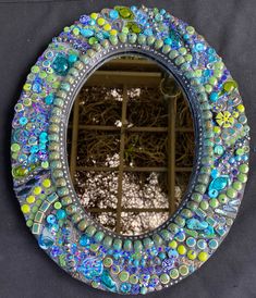 there is a mirror made out of glass beads