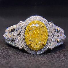 a fancy yellow and white diamond ring