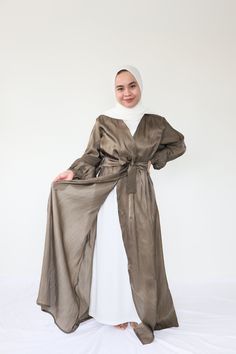 Shimmer abaya outer + Slip dress   * Material : Shimmer Silk   * STANDART SIZE Bust 105cm Lenght 130cm Sleeves 55cm   * UP SIZE Bust 115cm Length 135cm Sleeves 55cm Elegant Flowy Spring Abaya, Formal Long Sleeve Silk Abaya, Flowy Long Abaya For Eid, Satin Floor-length Abaya For Eid, Elegant Silk Abaya With Long Sleeves, Elegant Long Sleeve Silk Abaya, Elegant Long Maxi Dress For Eid, Long Silk Abaya For Eid, Silk Long Abaya For Eid