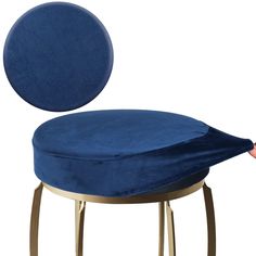 a blue cushion sitting on top of a metal stool with a gold frame around it