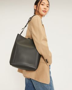 The Studio Bag Black – Everlane Modern Bucket Bag With Leather Handles For On-the-go, Business Shoulder Bag With Soft Leather And Double Handle, Trendy Business Bags With Leather Handles, Modern Business Bucket Bag With Adjustable Strap, Modern Leather Tote Backpack With Detachable Strap, Chic Business Hobo Tote Bag, Chic Hobo Tote Bag For Business, Chic Business Hobo Bag With Leather Handles, Business Crossbody Shoulder Bag With Leather Handles