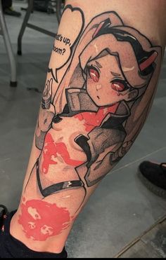 a woman's leg with an anime character tattoo on it and words above her