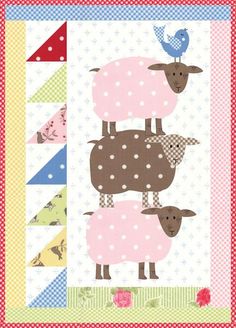 three sheep standing next to each other on top of a patchwork wallpaper border