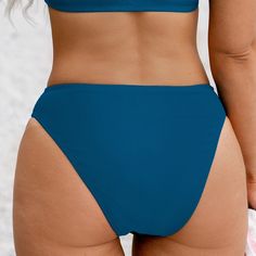 The Rib Mid-Rise Bikini Bottoms Swimsuit is an excellent choice for those who value both style and functionality. The ribbed fabric and mid-rise waistline offer a flattering and secure fit, while the bikini bottom style allows for versatility in mixing and matching with different tops or cover-ups. Whether you're lounging by the pool, swimming laps, or engaging in beach activities, these bikini bottoms provide the comfort and confidence you need to enjoy your time in the sun and water. Product c Fitted Solid Color Beach Bottoms, Fitted Solid Color Bottoms For Beach, Ribbed Swimming Bottoms For Summer, Ribbed Beachwear Swimwear For Swimming, Ribbed Stretch Swimwear For The Beach, Ribbed Beachwear Swimwear, Ribbed Stretch Swimwear For Pool, Stretch Ribbed Swimwear For Pool, Ribbed Fitted Swimwear For Poolside