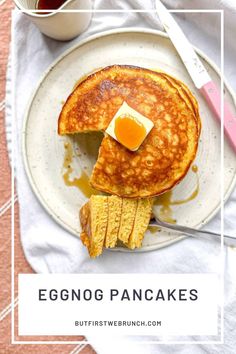 eggnog pancakes on a plate with butter and syrup