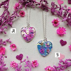 "Wear a piece of nature with one of these unique, handmade necklaces 🌿💜 ♡ Beautifully handcrafted with real flowers encased in resin with super sparkly glitter ✨ ♡ Each heart measures 2.5cm H x 2cm W  ♡ Attached to an 18\" Sterling silver chain,  ♡ Only 3 available - Red, Pink & Blue  ♡ Comes presented on a backing card with an Organza bag or the option of a lilac gift box for £1 extra - please see photos attached If you have any questions, please drop me a message 💜 Have a lovely day, Charlotte x" Handmade Silver Charm Necklace For Her, Handmade Silver Charm Necklace As Gift For Her, Handmade Sterling Silver Charm Necklace As Gift For Her, Handmade Heart Pendant Necklace For Mother's Day, Unique Silver Necklaces For Valentine's Day, Unique Silver Necklace For Valentine's Day, Unique Sterling Silver Necklace Gift For Her, Sterling Silver Flower Jewelry For Keepsake, Sterling Silver Flower Jewelry Keepsake