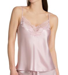 Add a touch of romance to the everyday (and sensual nights) with this shimmering silk camisole, embellished with floral lace at the neckline. Made from woven silk satin. V-neckline is trimmed with a tall band of floral lace. Lustrous satin body is cut on the bias for flattering, draped fit. Narrow, non-stretch fabric straps are fully adjustable in back with goldtone metal hardware. Straight back edge. Hip length, edge-finished hem. Perfect for any season in a lightweight silk. GINIA Women's Silk Feminine Silk V-neck Camisole, Elegant Sleeveless Silk Sleepwear, Elegant Cami Sleepwear For Spring, Elegant Spring Camisole Sleepwear, Feminine Silk Camisole Sleepwear, Elegant Lace Trim Cami Sleepwear, Elegant Tank Top With Lace Trim For Loungewear, Sleeveless Modal Satin Sleepwear, Feminine Satin Camisole With Lace Trim