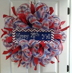 a red, white and blue wreath with the words happy 21st y'all on it