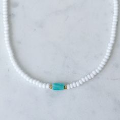 Dainty beaded choker necklace with a turquoise amazonite bar surrounded by small galvanized gold beads. Necklace is about 14 inches with a 2 inch extender. Cheap Turquoise Necklace With Tiny Beads, Adjustable Turquoise Beaded Amazonite Necklaces, Adjustable Heishi Beads Choker, Dainty Adjustable Choker With Spacer Beads, Turquoise Heishi Beads Jewelry With Beaded Chain, Heishi Beads Choker Jewelry Gift, Adjustable Beaded Turquoise Necklace, Adjustable Turquoise Beaded Chain Necklace, Adjustable Turquoise Beaded Chain Choker