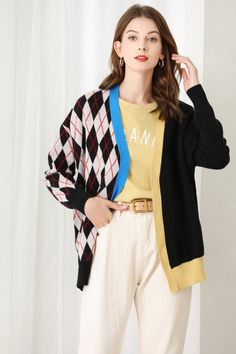 Fabric: 32.8% Wool 35.3% Polyester 31.9% Nylon Color: Black, White, Blue Care: Hand wash or dry clean This oversized cardigan is argyle detail and splicing stitch. This oversized cardigan is a great layering piece. The V neckline and rib cuff and bottom make it easy to wear over any outfit. Long sleeves. Contrast colors. Front button closure. Model is 175cm/5'9" tall. Trendy Patchwork Cardigan For Spring, Fall Long Sleeve Cardigan With Contrast Color, Patchwork Sweater For Spring Layering, Spring Patchwork Sweater For Layering, Black Color Block Outerwear For Layering, Long Sleeve Cardigan With Contrast Color For Layering, Color Block Cardigan For Winter, Long Sleeve Cardigan For Layering With Contrast Color, Trendy Winter Cardigan With Contrast Color