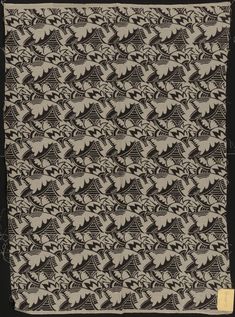 an old black and white cloth with designs on it