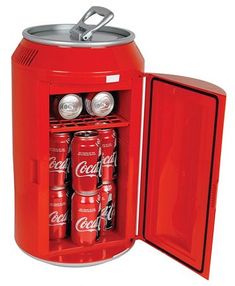 an open coca - cola cooler with six cans in it