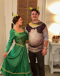 a man and woman dressed up in costumes