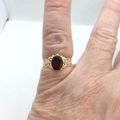 Beautiful Antique Garnet ring Victorian ring in gold  with a bezel set oval Garnet.  This ring has beautiful inverted heart shoulders in gold . This ring is a size 6 and signed but I don't know the maker. The garnet is 10 x 8 mm and the top of the ring measures 5mm x 7 mm inch  Gift Box with purchase Antique Garnet Ring, Victorian Ring, Garnet Gem, Ring Bezel, Victorian Rings, Garnet Ring, Garnet Rings, Stackable Rings, Bezel Setting