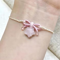 Pink Stone Bowknot Star Bracelet Add an elegant touch to any outfit with our adorable Pink Stone Bowknot Star Bracelet! Made with delicate pink stones and a charming bowknot and star design, this bracelet is perfect for adding a touch of cuteness to your ensemble. A must-have for all fashion lovers! Sanrio Jewelry, Pink Charm Bracelet, Kawaii Bracelet, Hand Jewelry Rings, Braided Bracelet Diy, Pink Stones, Gold Girl, Chalcedony Stone, Magical Jewelry