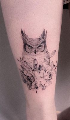 an owl and flowers tattoo on the right leg is shown in black and grey ink