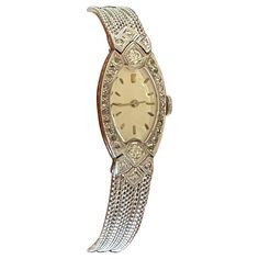 This stunning and very elegant oval 1920 Art Deco wrist watch features a platinum and Diamonds case along with the dial's stylized numerals. The white gold mesh band is smooth, sleek and has an adjustable buckle to accommodate many wrist sizes. Movement is manual winding and is working properly. Length: 17.5cm. Case size: 1.7cm m x 2.5cm Masterfully handcrafted piece! Authenticity and money back is guaranteed. For any enquires, please contact the seller through the message center. Luxury Art Deco Watch With Manual Winding, 1920 Art, 1920 Art Deco, Message Center, Art Deco Watch, Watch Jewelry, Gold Art Deco, Art Deco Diamond, Gold Art