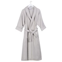 Upgrade your bath to a personal spa experience with the Waffle Weave Cotton Bathrobe by Blue Nile Mills. Crafted from Cotton, this unisex adult robe features a timeless honeycomb texture and solid color design. The classic waffle weave robe is highly-absorbent to offer a cozy and comfortable feel. Combining warmth and splendor, this bathrobe is complete with a full shawl collar to keep your neck toasty warm, a matching belt, two front patch pockets and fold-back cuffs. Available in a variety of Robe For Men, Linen Bathrobe, Bath Essentials, Hooded Towel, Waffle Weave, Blue Nile, Sleepwear Robe, Neck Warmer, Shawl Collar