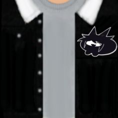 a close up of a person wearing a black and white shirt with a cat patch on it