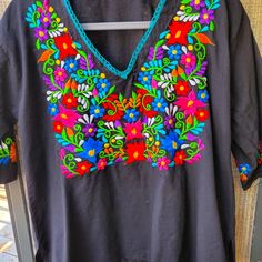 Cotton (?) Intricate Colorful Embroidery Sz Medium To Large. Labeled G. Imported From Mexico. Black Embroidered Top With Geometric Patterns For Festivals, Black Embroidered Top With Geometric Design For Festival, Black Embroidered Top For Festival, Black Tops With Geometric Embroidery For Festivals, Black Traditional Embroidered Top With Geometric Design, Black Top With Geometric Embroidery For Festivals, Black Tops With Intricate Embroidery For Festival, Black Top With Intricate Embroidery For Festival, Black Blouse With Intricate Embroidery For Festival