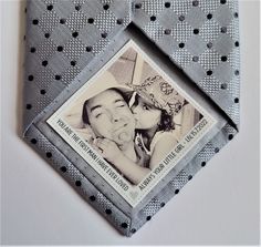 a tie with an image of a man kissing a woman on the inside of it